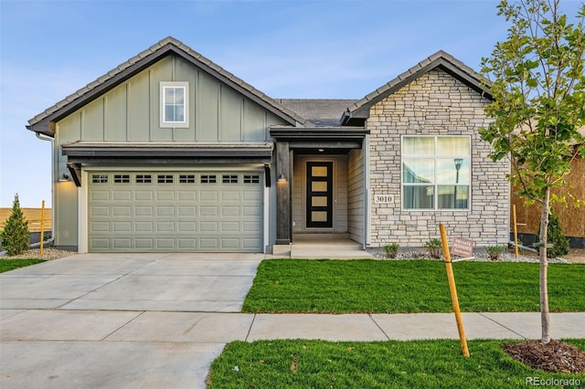 view of front facade with a front yard and a garage