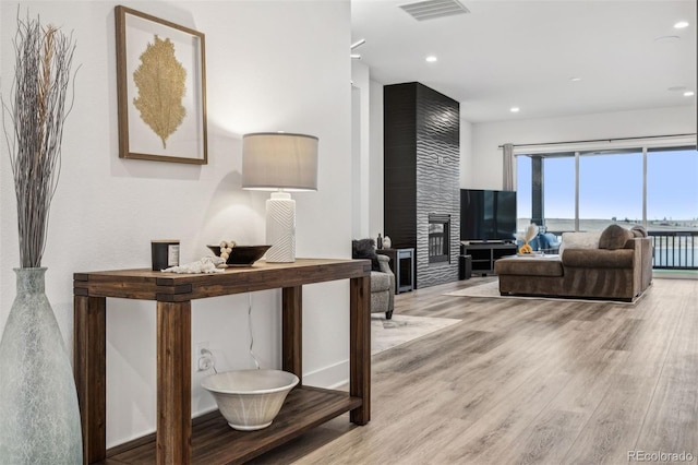 interior space featuring light hardwood / wood-style flooring and a fireplace