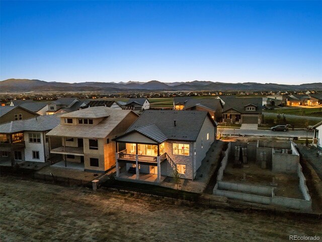 rear view of property with a mountain view