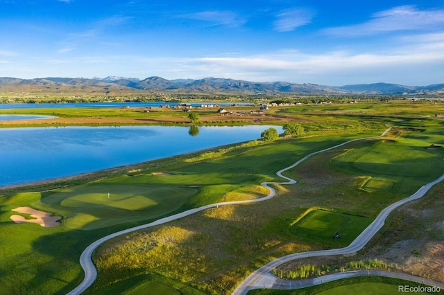 birds eye view of property featuring a water and mountain view