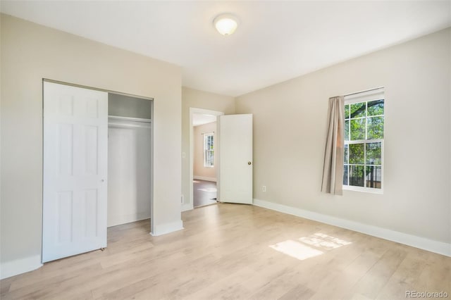614 W Kiowa St, Colorado Springs, CO 80905 - unfurnished bedroom featuring light wood-type flooring, baseboards, and a closet