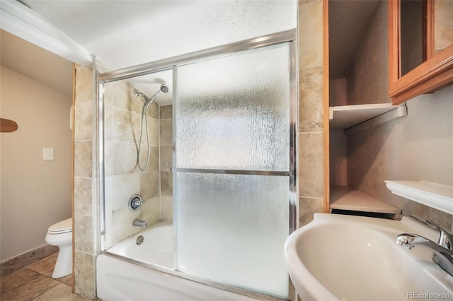 614 W Kiowa St, Colorado Springs, CO 80905 - full bath with toilet, a sink, and shower / bath combination with glass door