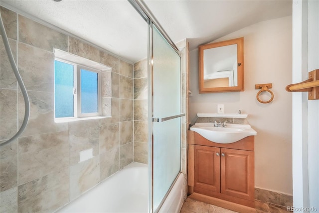 614 W Kiowa St, Colorado Springs, CO 80905 - bathroom featuring vanity, enclosed tub / shower combo, and vaulted ceiling