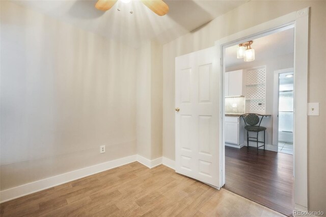 614 W Kiowa St, Colorado Springs, CO 80905 - unfurnished room with light wood finished floors, a ceiling fan, and baseboards