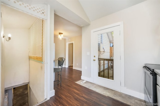 614 W Kiowa St, Colorado Springs, CO 80905 - hallway with wood finished floors, vaulted ceiling, and baseboards