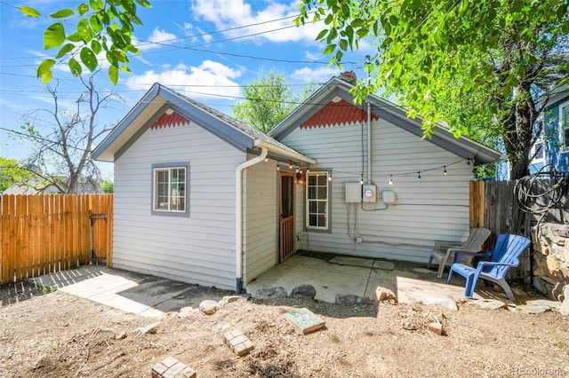 614 W Kiowa St, Colorado Springs, CO 80905 - rear view of house with a patio and a fenced backyard