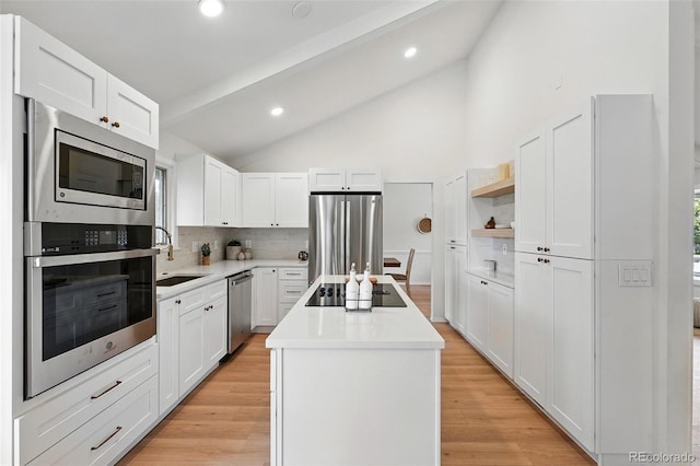 5616 S Kenton Ct, Englewood, CO 80111 - kitchen featuring stainless steel appliances, a kitchen island, tasteful backsplash, open shelves, and white cabinetry