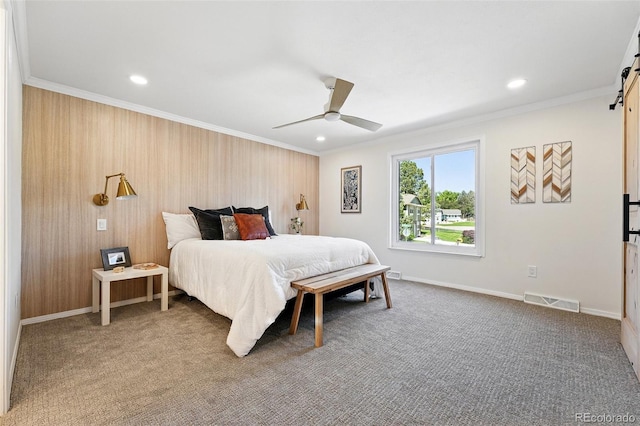 5616 S Kenton Ct, Englewood, CO 80111 - carpeted bedroom featuring a barn door, ornamental molding, recessed lighting, a ceiling fan, and baseboards