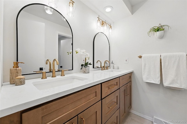 5616 S Kenton Ct, Englewood, CO 80111 - full bath featuring double vanity, baseboards, and tile patterned flooring