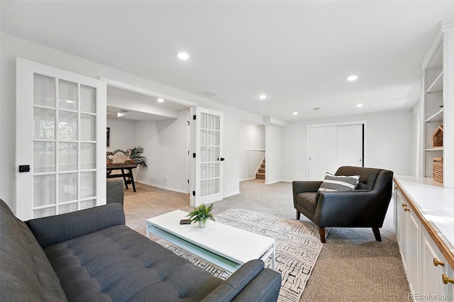 5616 S Kenton Ct, Englewood, CO 80111 - living area with french doors, light colored carpet, recessed lighting, stairs, and baseboards