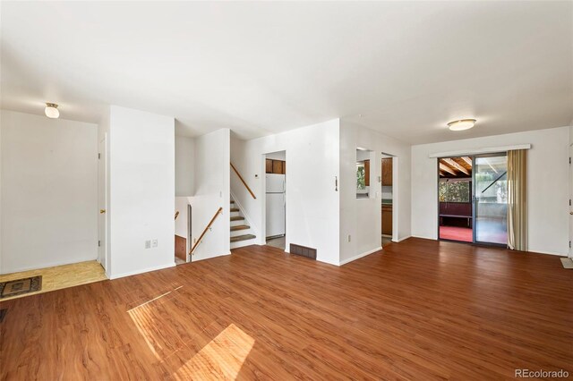 empty room with wood-type flooring