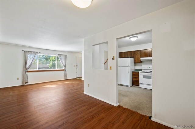 unfurnished living room featuring wood-type flooring