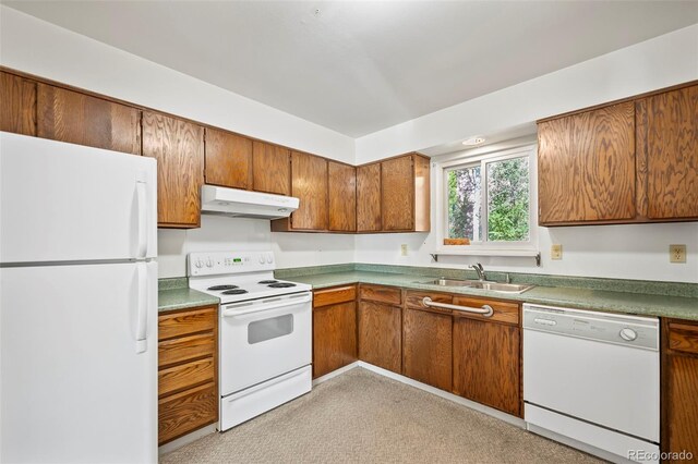 kitchen with sink and white appliances