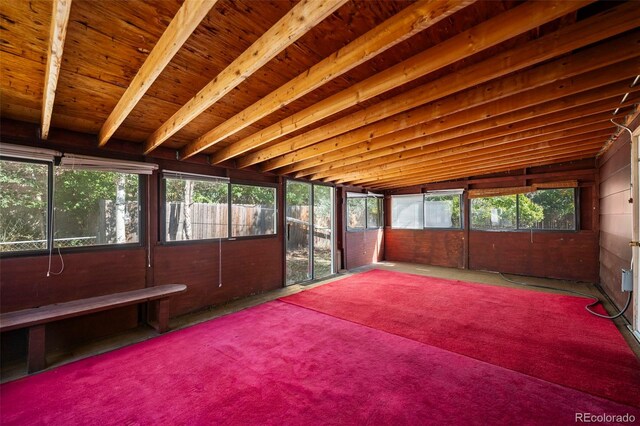 unfurnished sunroom featuring lofted ceiling