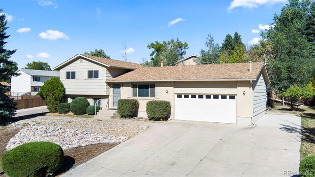 split level home featuring a garage