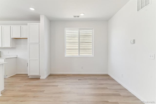 449 S Salida St, Aurora, CO 80017 - unfurnished dining area with light wood-type flooring, baseboards, and recessed lighting