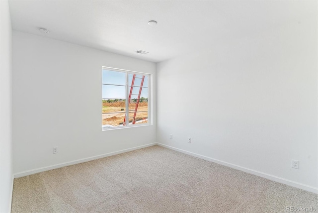 449 S Salida St, Aurora, CO 80017 - carpeted spare room featuring baseboards and a smoke detector