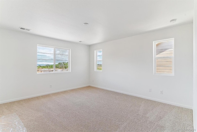 449 S Salida St, Aurora, CO 80017 - unfurnished room featuring light carpet, baseboards, and a smoke detector