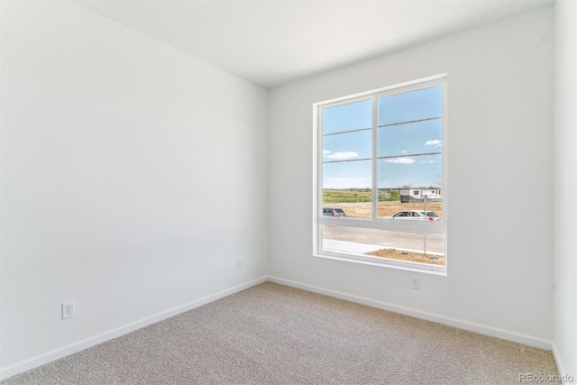 449 S Salida St, Aurora, CO 80017 - unfurnished room with carpet floors, plenty of natural light, and baseboards