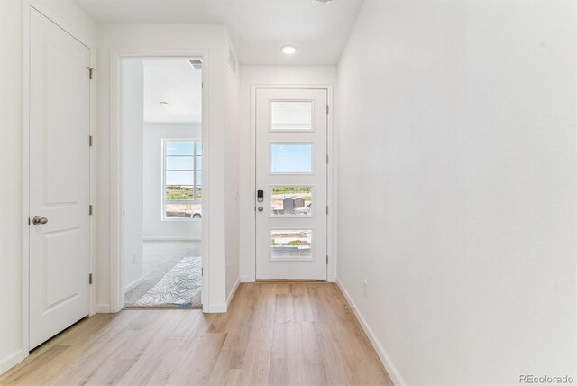449 S Salida St, Aurora, CO 80017 - entrance foyer with light wood finished floors and baseboards