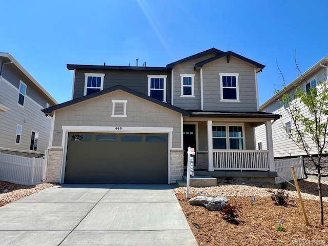 449 S Salida St, Aurora, CO 80017 - craftsman-style house featuring covered porch, stone siding, an attached garage, and concrete driveway