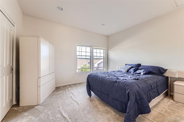 15501 E 112th Ave Unit 28E, Commerce City, CO 80022 - bedroom with light carpet and recessed lighting