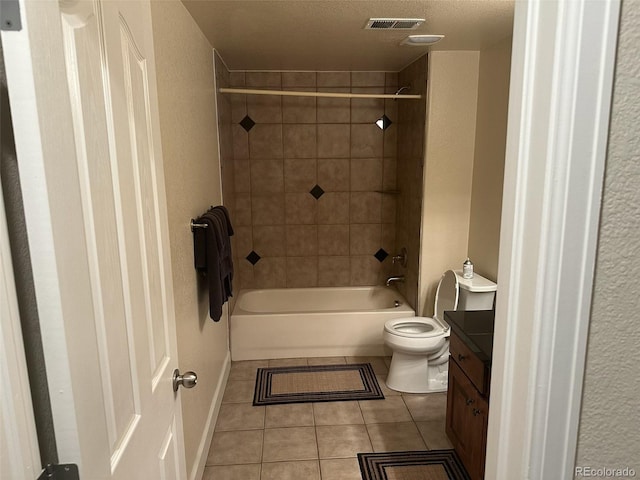 15501 E 112th Ave Unit 28E, Commerce City, CO 80022 - full bathroom with tile patterned floors, vanity, toilet, and  shower combination