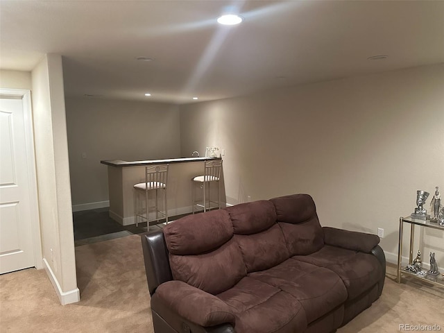 15501 E 112th Ave Unit 28E, Commerce City, CO 80022 - living room featuring a dry bar, baseboards, light colored carpet, and recessed lighting