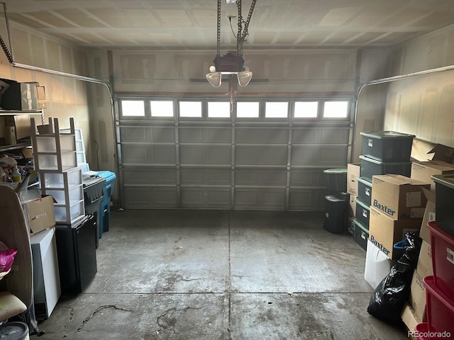 15501 E 112th Ave Unit 28E, Commerce City, CO 80022 - garage featuring a garage door opener