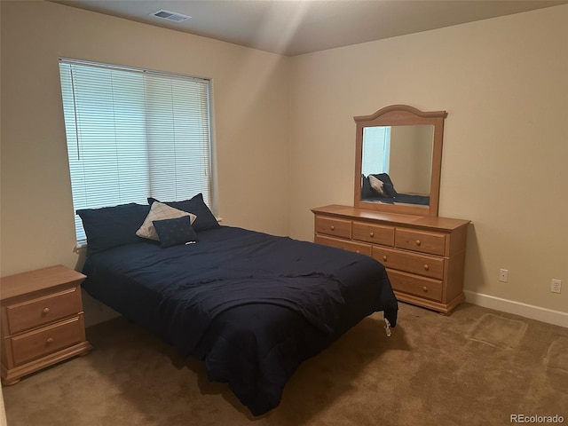 15501 E 112th Ave Unit 28E, Commerce City, CO 80022 - bedroom with light carpet and baseboards