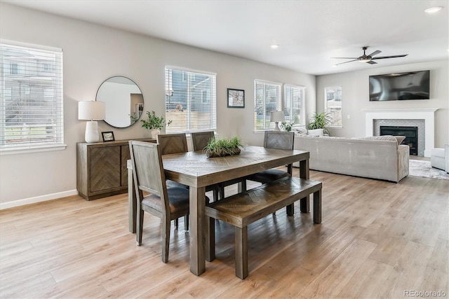 dining room featuring a ceiling fan, baseboards, recessed lighting, and light wood-style flooring