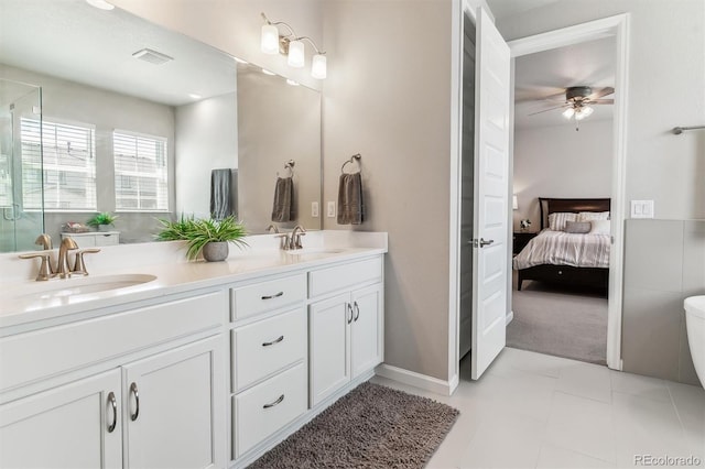 bathroom with visible vents, a sink, connected bathroom, and a ceiling fan