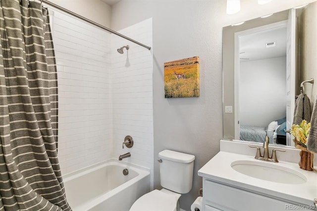 full bathroom with vanity, toilet, and shower / tub combo