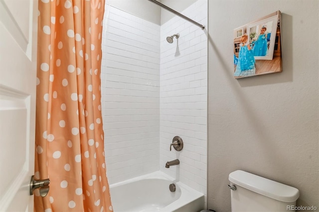 bathroom with toilet and shower / tub combo