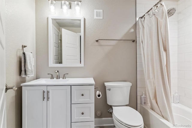 full bathroom with vanity, shower / tub combo with curtain, toilet, and visible vents