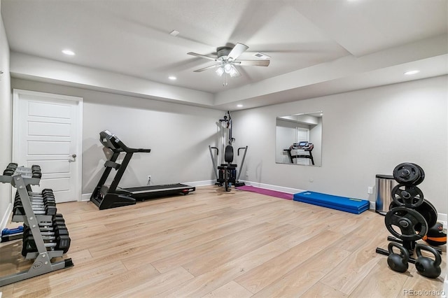 workout room with recessed lighting, baseboards, ceiling fan, and light wood-type flooring