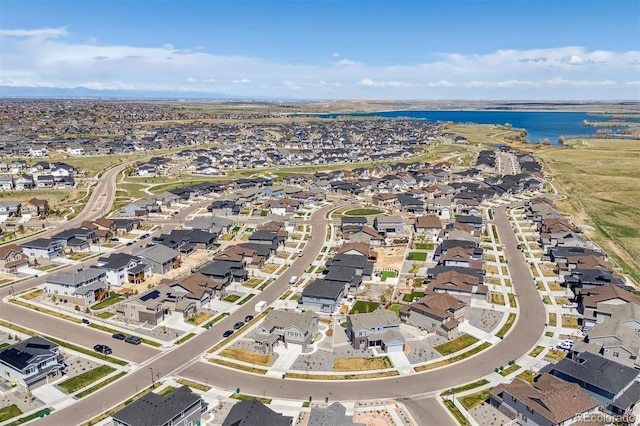 birds eye view of property featuring a residential view and a water view