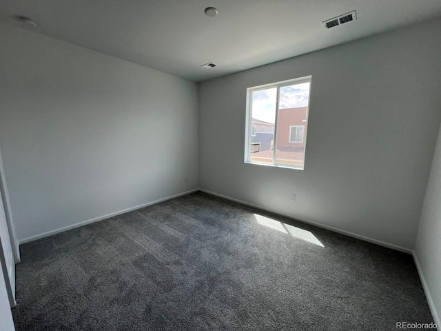 6599 N Netherland St, Aurora, CO 80019 - carpeted empty room featuring baseboards and a smoke detector