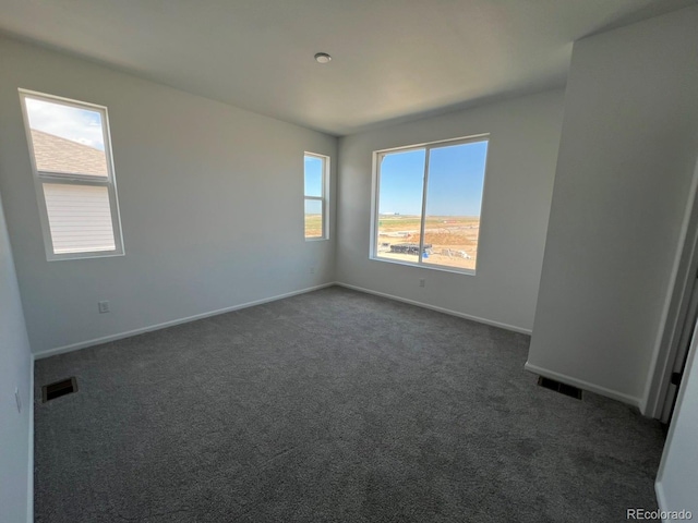 6599 N Netherland St, Aurora, CO 80019 - unfurnished room with dark carpet and baseboards