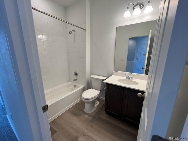 6599 N Netherland St, Aurora, CO 80019 - full bath featuring wood finished floors, vanity, and shower / bathtub combination