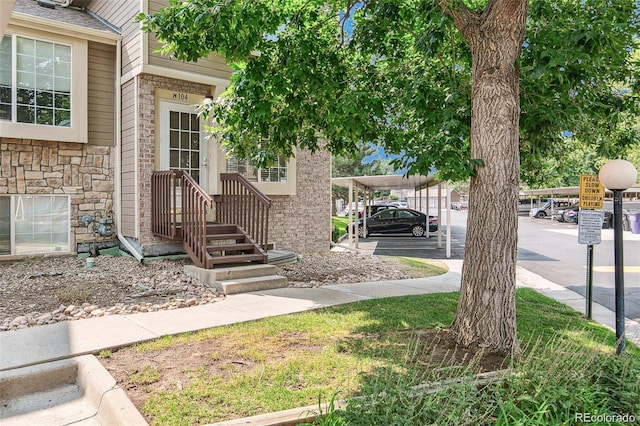 exterior space featuring a carport