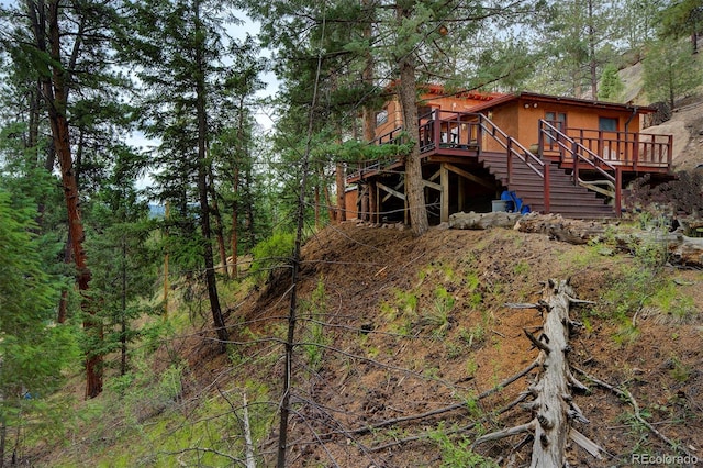 view of yard featuring a wooden deck