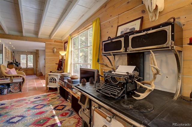 kitchen with wood walls, tile countertops, hardwood / wood-style flooring, and lofted ceiling with beams