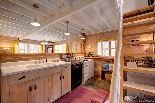 kitchen featuring a wealth of natural light, wooden walls, and beam ceiling