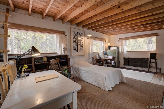 bedroom featuring multiple windows, beamed ceiling, and wood ceiling