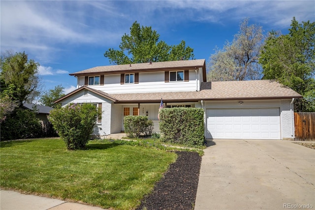 traditional home with a garage and concrete driveway