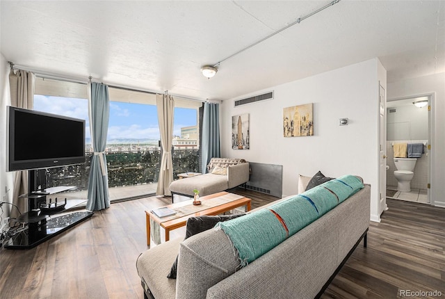 1020 15th St Unit 12C, Denver, CO 80202 - living area with a wall of windows and wood finished floors