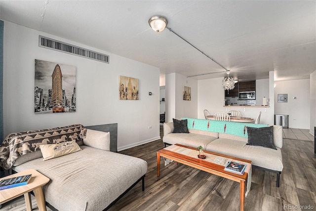 1020 15th St Unit 12C, Denver, CO 80202 - living room featuring wood finished floors and a chandelier