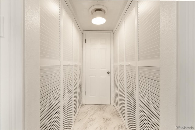 3341 S Monaco Pkwy Unit A, Denver, CO 80222 - corridor featuring light marble finish flooring