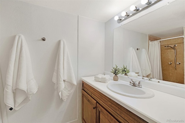 3341 S Monaco Pkwy Unit A, Denver, CO 80222 - full bathroom featuring vanity and a tile shower